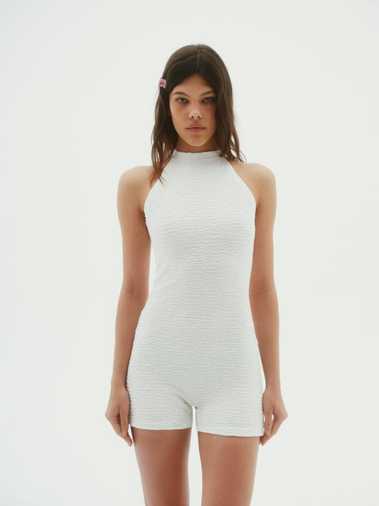White textured open-shoulder jumpsuit with high neckline